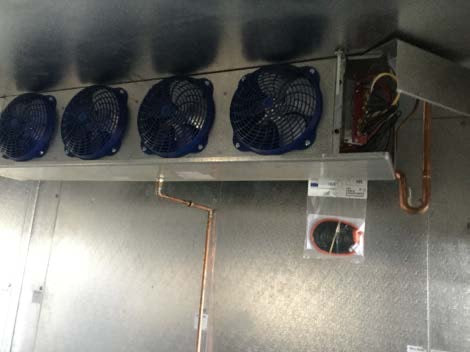 a couple of fans that are on a wall